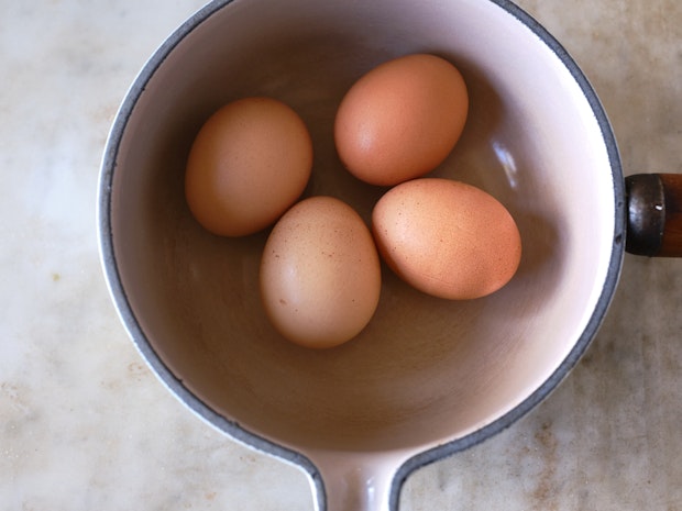 eggs placed into an empty saucepan