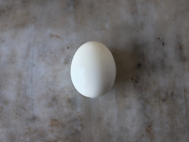 one peeled pard boiled egg