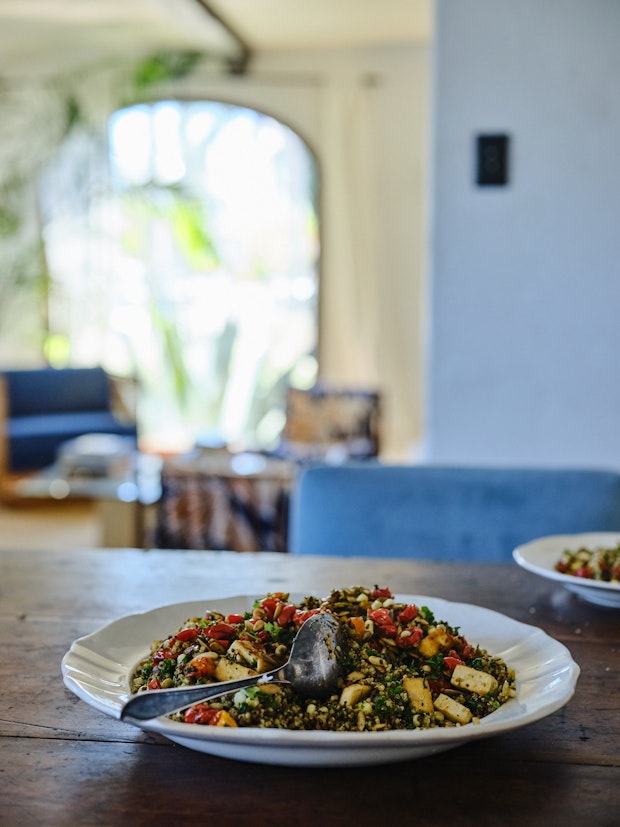 Big plate of quinoa with tomatoes, pesto, and pepitas