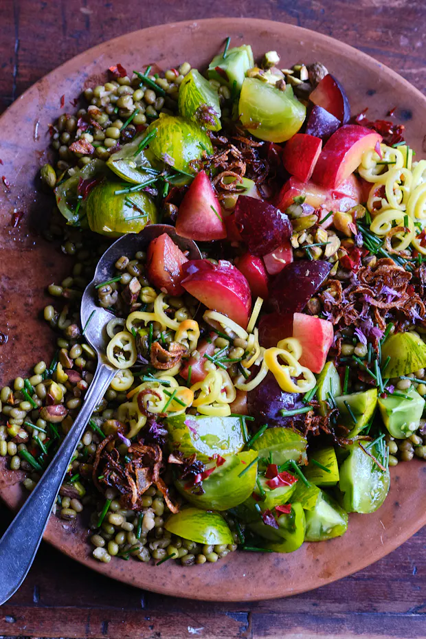 summer lunch salad with pluots, peppers, beans, tomatoes