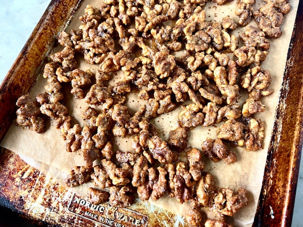 candied walnuts cooling on a baking sheet