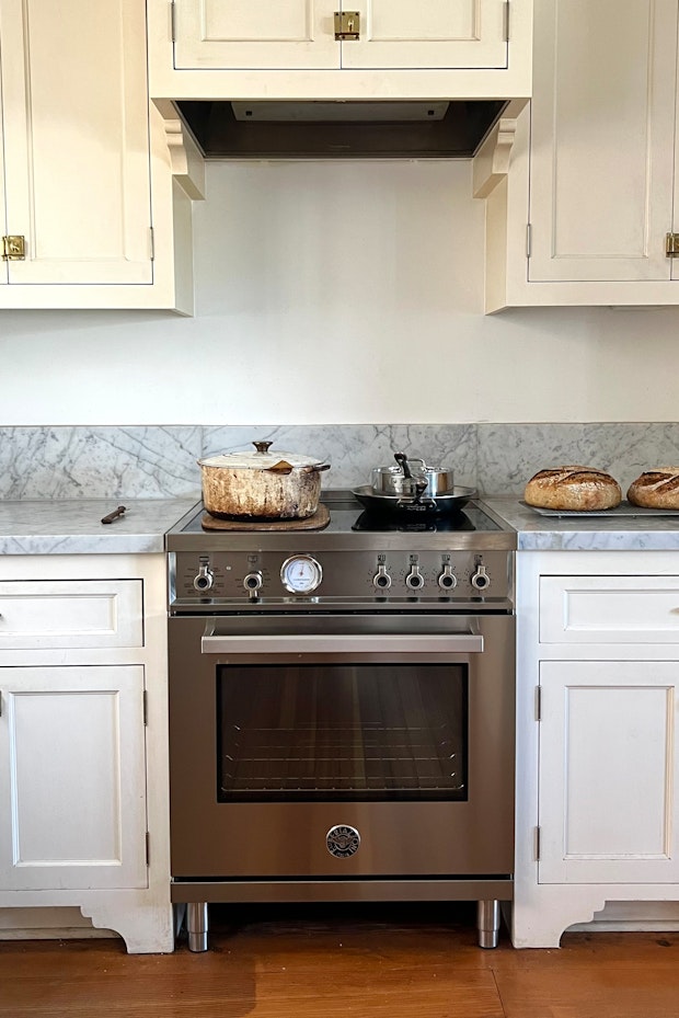 induction stove in kitchen with marble counters