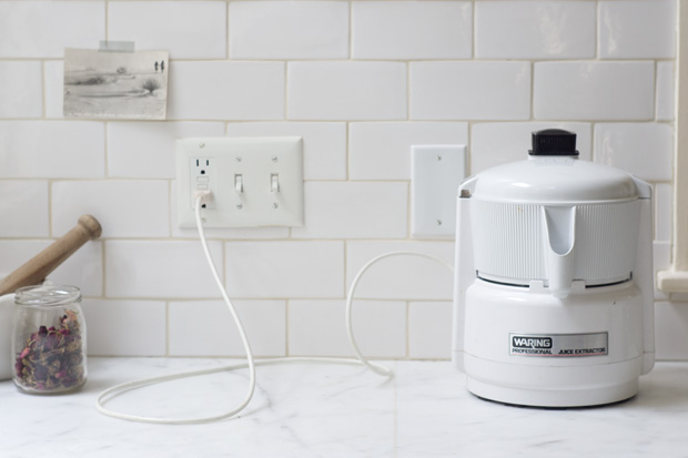 A waring centrifugal juicer on a counter