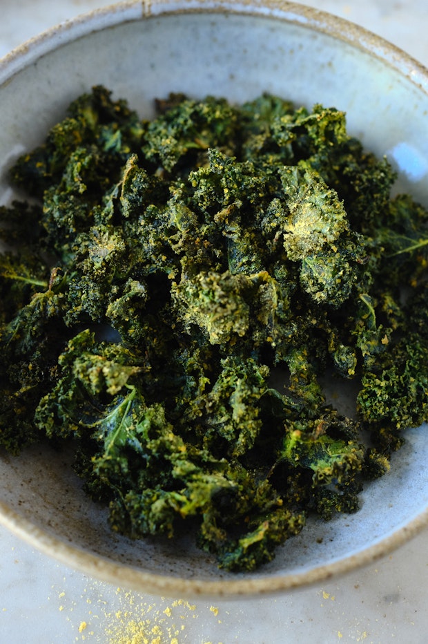 Crispy baked kale chips in a bowl