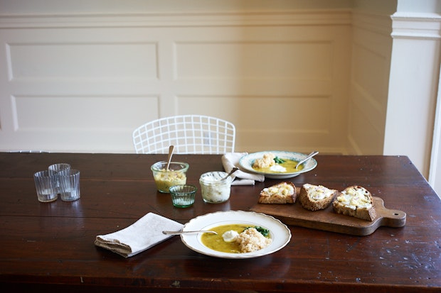 lemon chutney smeared on sourdough toast  served along with soup on a wood table
