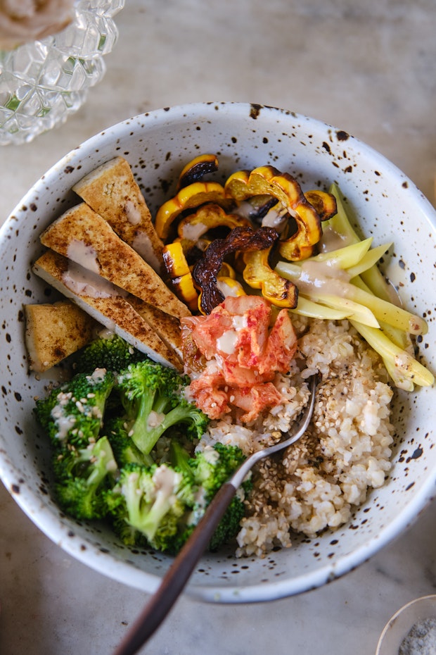 macro bowl with colorful vegetables and brown rice