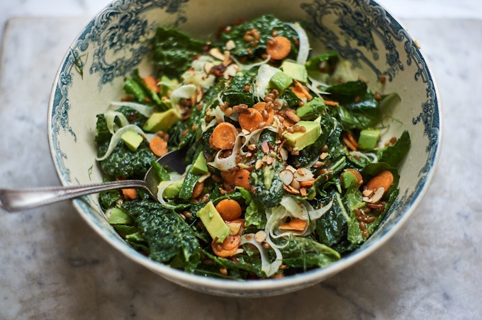 Market Kale Salad in large bowl with carrots, farro, avocado