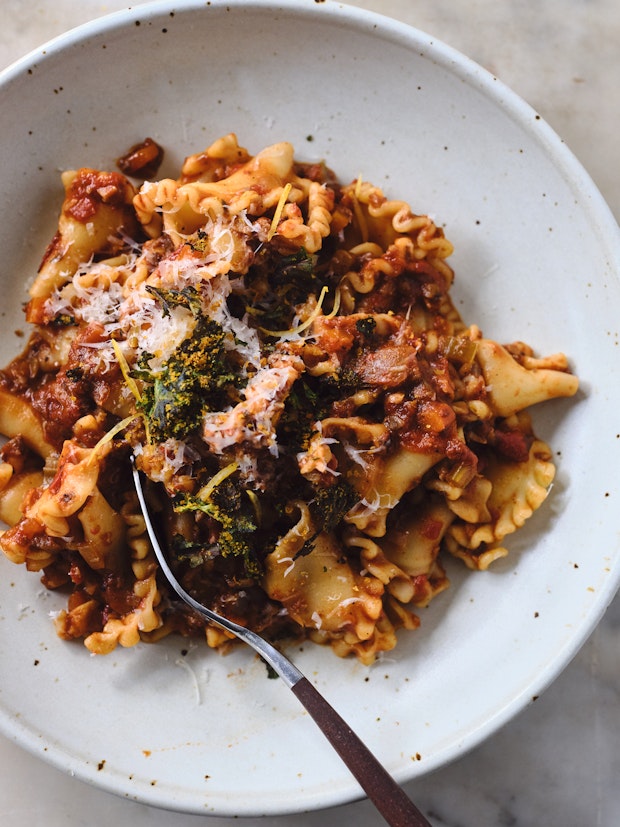 Mushroom ragù served over pasta in a wide bowl