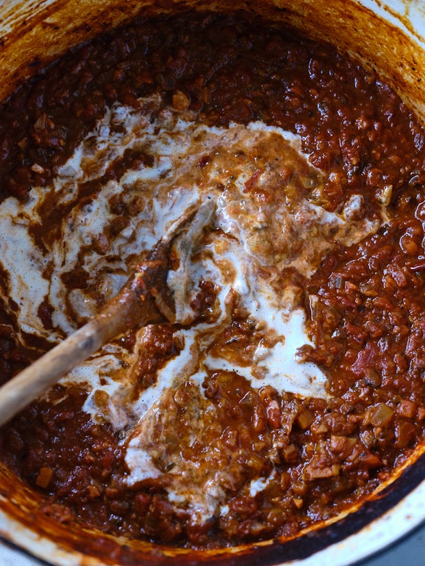 Pot of Mushroom ragu with wooden spoon