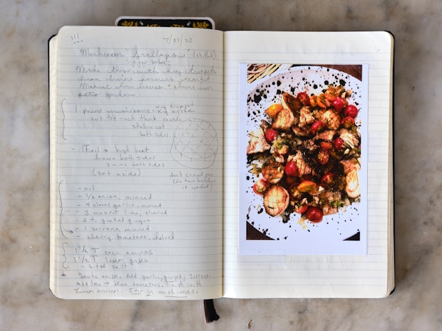 notebook with mushroom scallops recipe written out in pencil