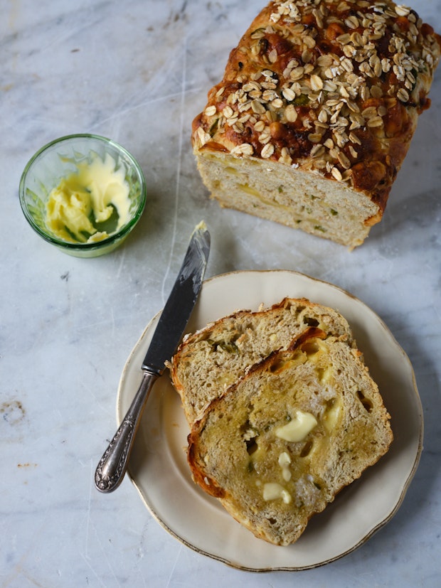 Slices of Cheddar Jalapeño Oatmeal Bread with Butter