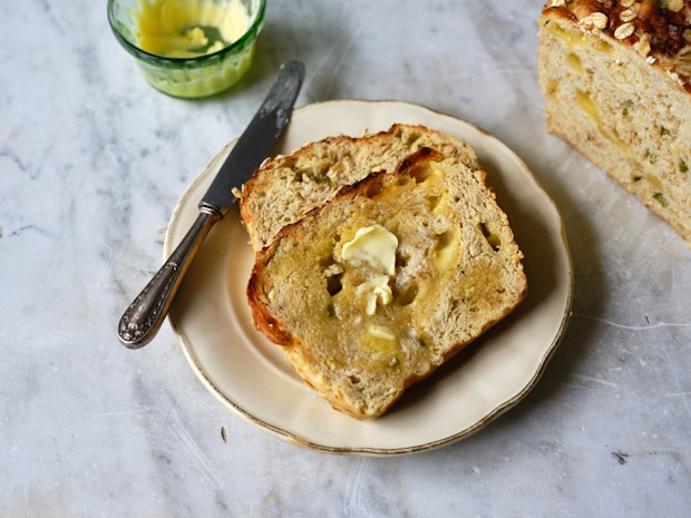 Slices of Cheddar Jalapeño Oatmeal Bread with Butter