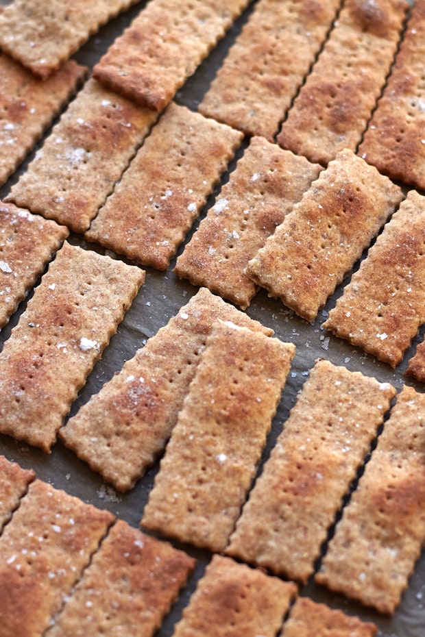 oatmeal crackers arranged on a baking sheet