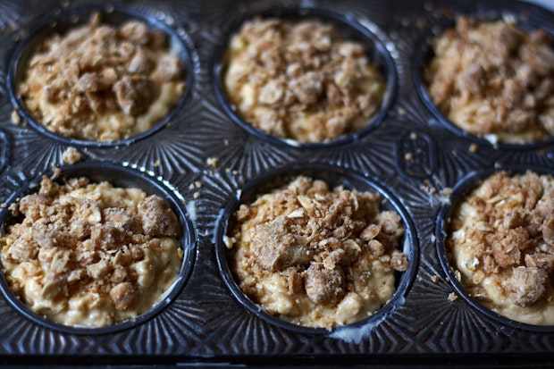 muffin batter in muffin tin before baking