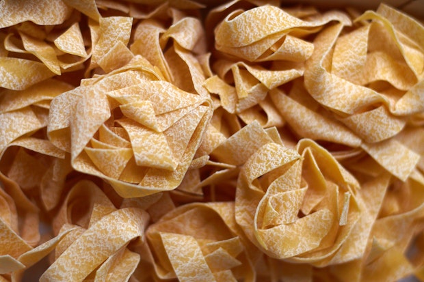 tangles of dried pappardelle pasta