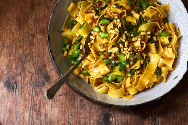 pappardelle with spiced butter served on a wood table