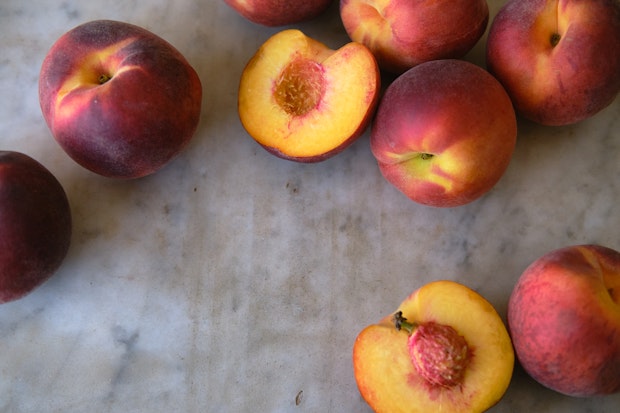 ripe peaches on counter for peach cobbler