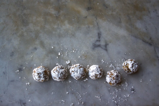 small pistachio cookies on marble counter