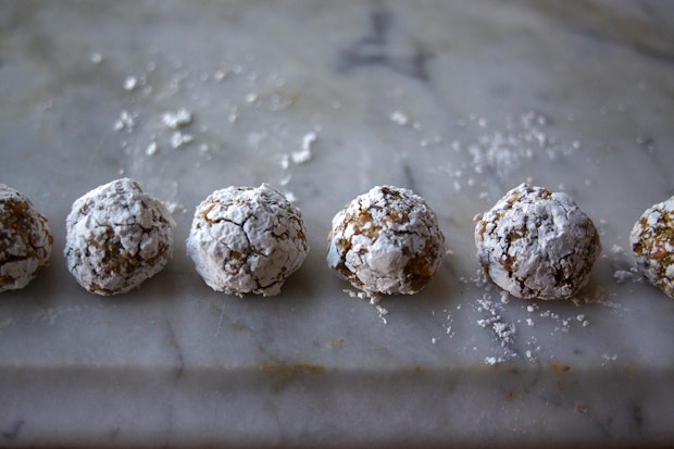 small pistachio cookies (biscotti) on marble counter