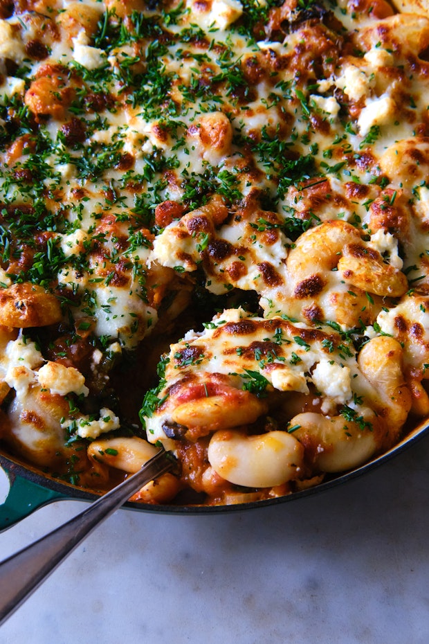 pizza beans in a large skillet topped with melted cheese