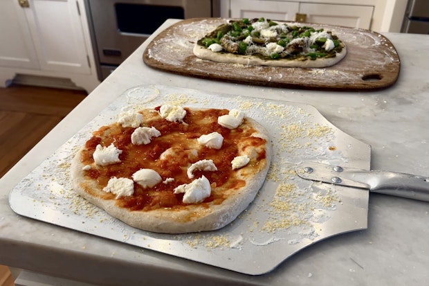 Two Pizzas Prepared Side by Side Ready to Be Baked