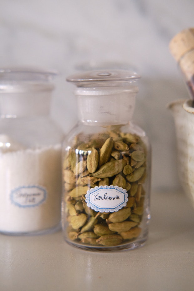 a glass jar of cardamom pods to use in the red gomashio spice blend