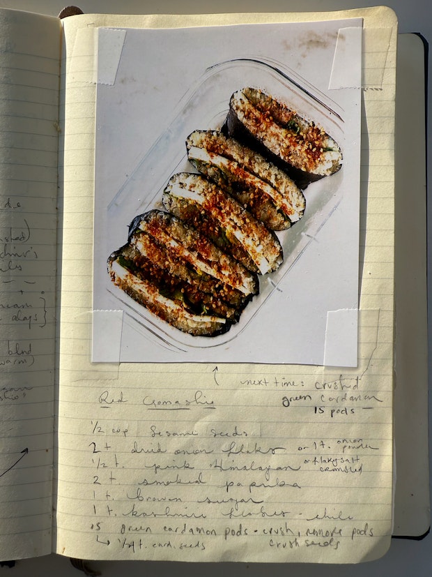 Red gomashio sesame salt sprinkled on onigirazu in a lunchbox