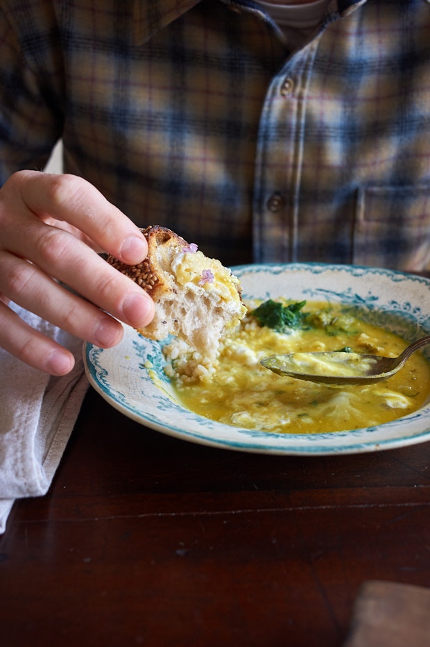 eating lentil soup and crusty bread