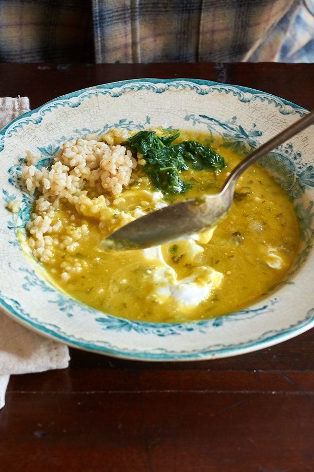 lentil soup in a bowl with rice and yogurt