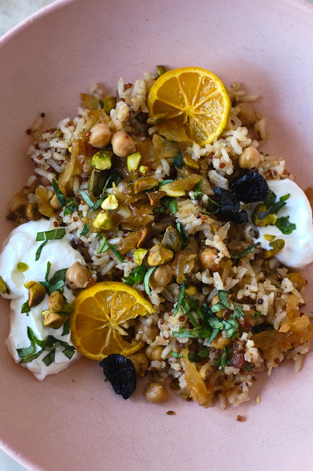 rice pilaf served in a bowl with an assortment of toppings