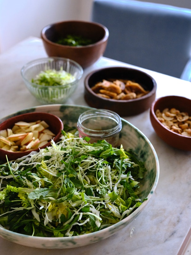 Ingredients for shredded chicken salad arranged on a countertop