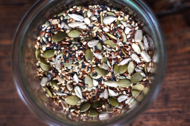 medley of six different seeds combines in a glass jar