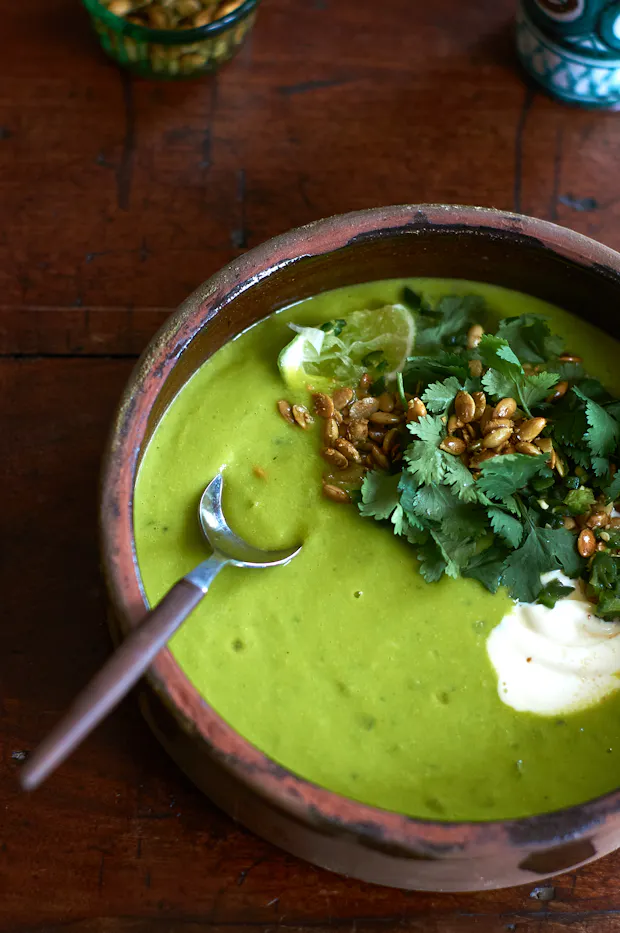 Sopa Verde de Elote soup in a clay bowl
