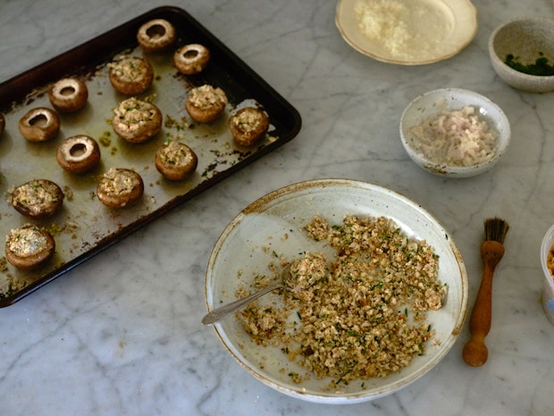 ingredients for making stuffed mushrooms on a kitchen counter