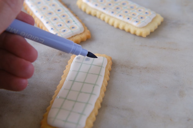 decorating sugar cookies with royal icing and edible ink marker