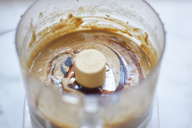 adding vanilla extract to sunflower seed butter in food processor