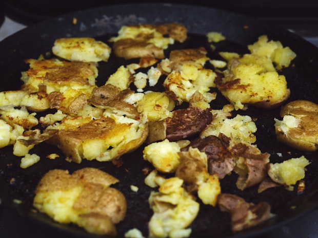 smashed skillet potatoes in a skillet