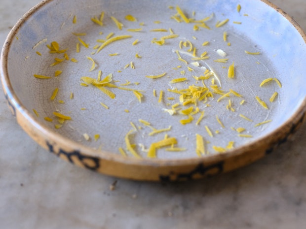 pie plate prepared with bitter and lemon zest