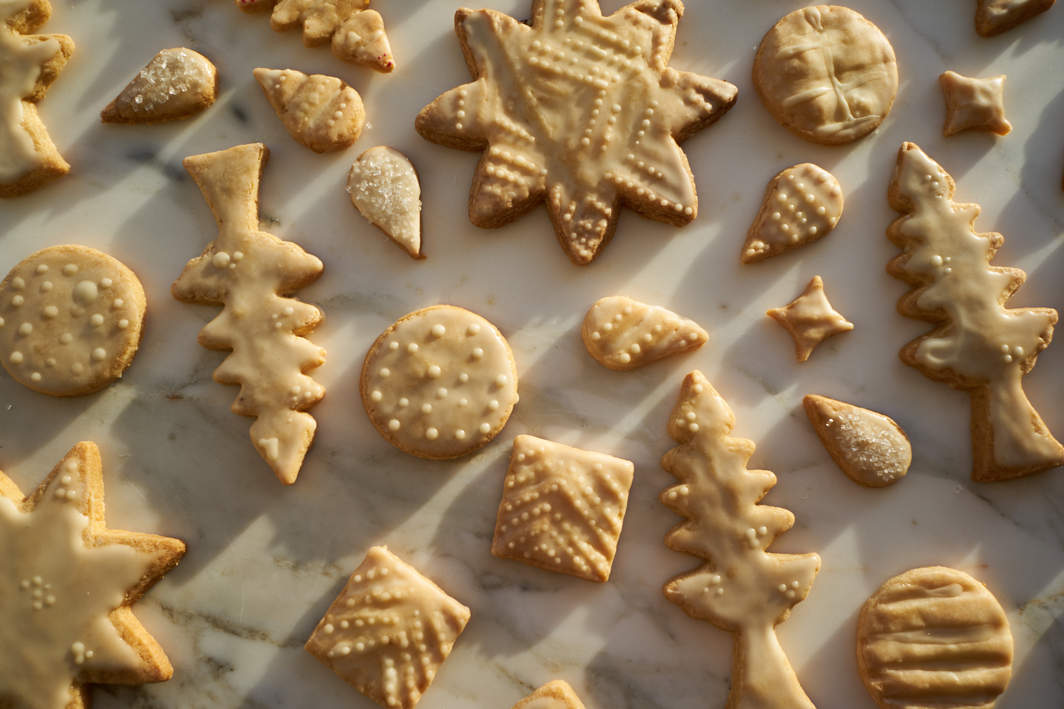 Beautiful, iced sugar cookies as part of a list of best christmas cookie recipes
