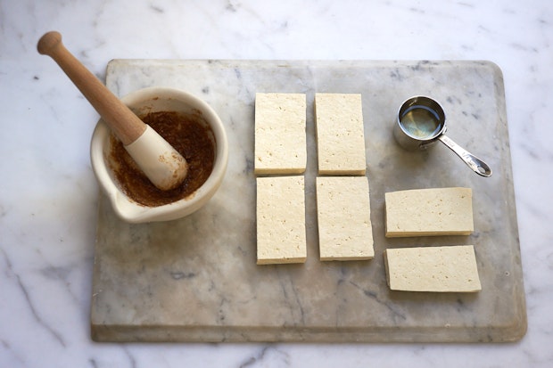 Tofu sliced on a cutting board