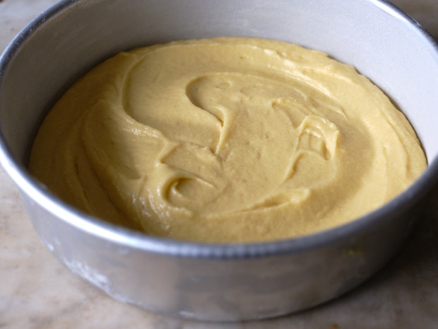 yellow cake batter in a baking pan prior to going in the oven