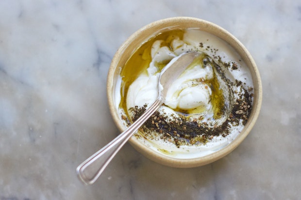 za'atar sprinkled over yogurt with olive oil