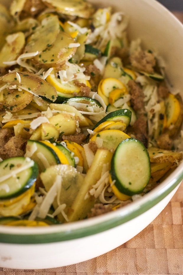 sliced zucchini tossed with cheese and bread crumbs