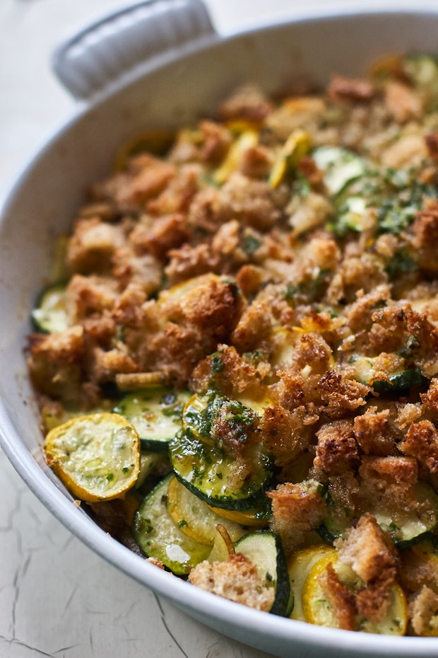 zucchini gratin with lots of breadcrumbs in a baking dish